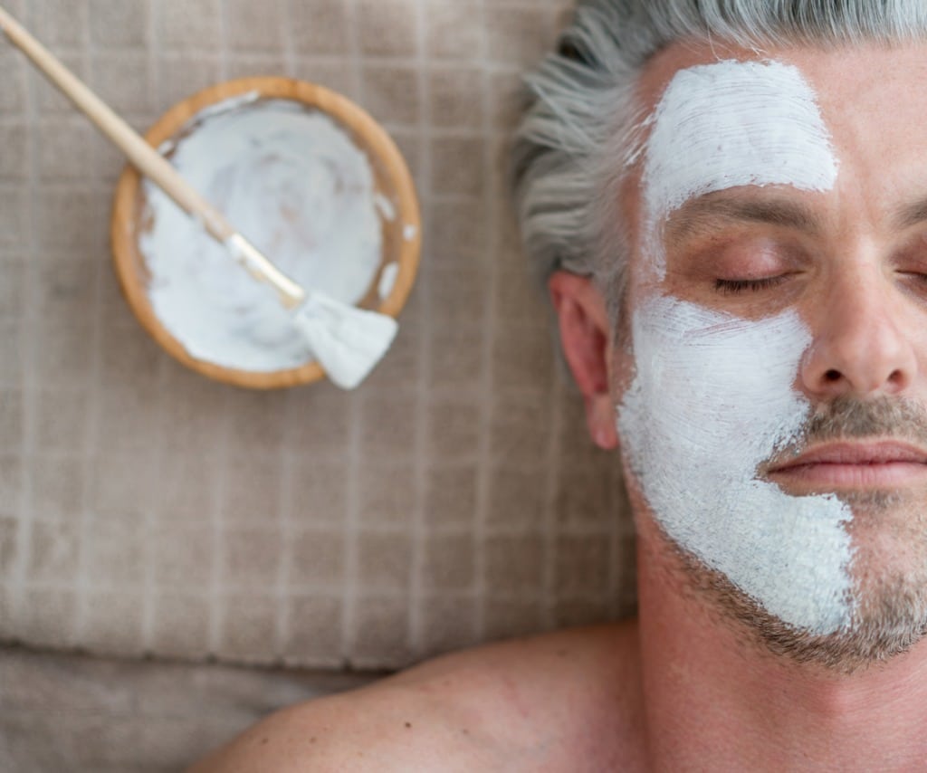 man getting a facial at the spa picture id695685990